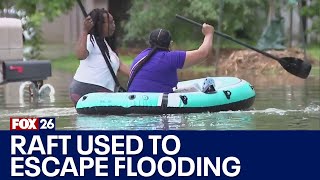 Conroe family use small boat to escape flooded neighborhood