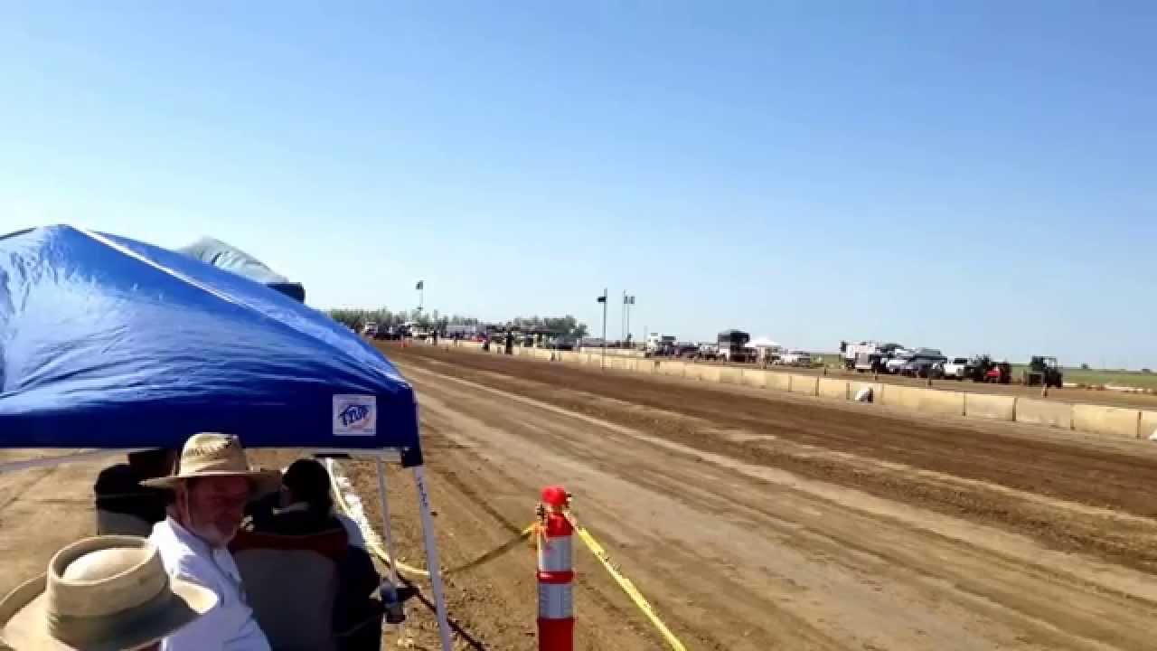 My friend Gordon Parish Sr. Running his Datsun at Eagle Field Drag