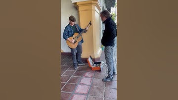 Thumbnail of I’m busking when Jackson Browne ambles up to swap tunes and stories & gives me his cool thumbpick.