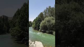 Mesmerizing River Flowing Through a Lush Valley