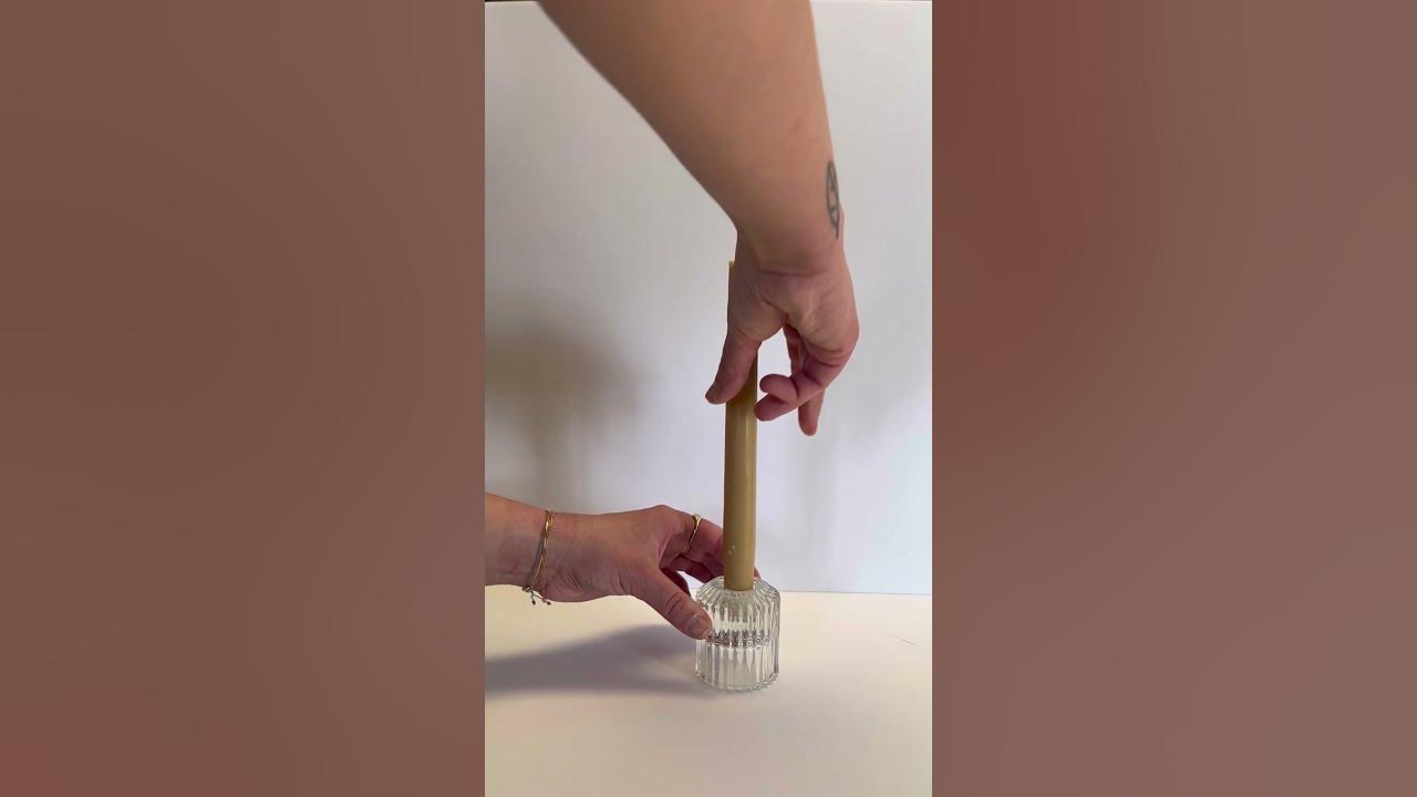 This $7 Adhesive Prevents Taper Candles From Tipping