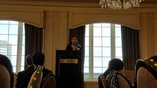 Advisor and Program Coordinator gives speech on behalf of the YMCA International Learning Center