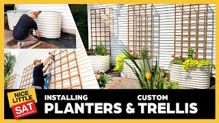 New space! Raised bed planters with irrigation and custom trellis