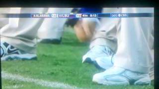 Les Miles eats grass