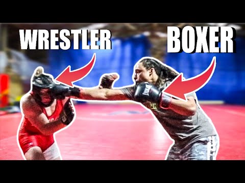 Video: Who Is Stronger: Boxer Or Wrestler