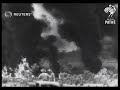 JAP AIR RAID ON NEW GUINEA. Jap bombers attack and score hit on oil dump in New Guinea. (1943)