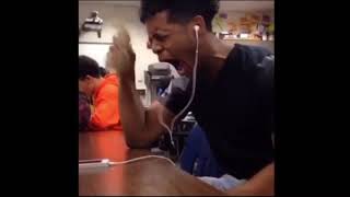 Black guy crying while listening to music