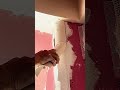 The process of scraping corner putty on the wall