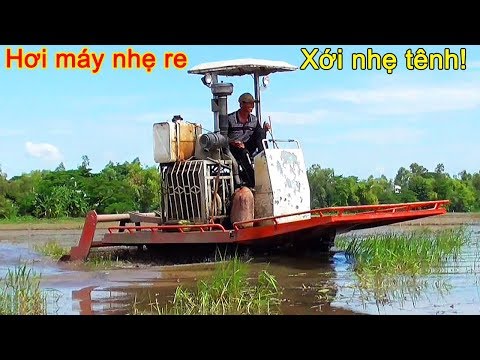 Strangest rubber crawler track tractor with rotary tiller working under water