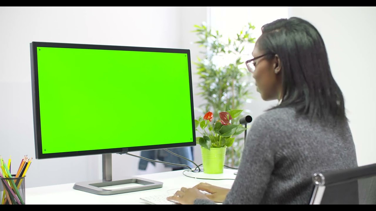 Woman Working at Computer Chroma Screen | Free Stock Video Footage Download | Green screen effect