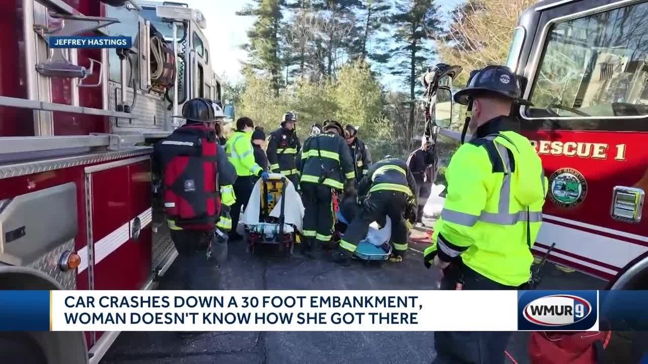 Driver rescued after car goes down 30-foot embankment in Manchester ...