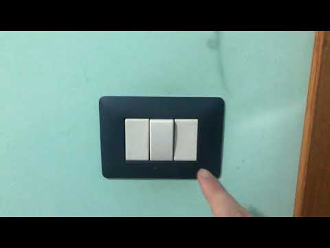 hand turning off the light