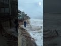 Nor'easter waves sweep seawater toward North Carolina beachfront properties