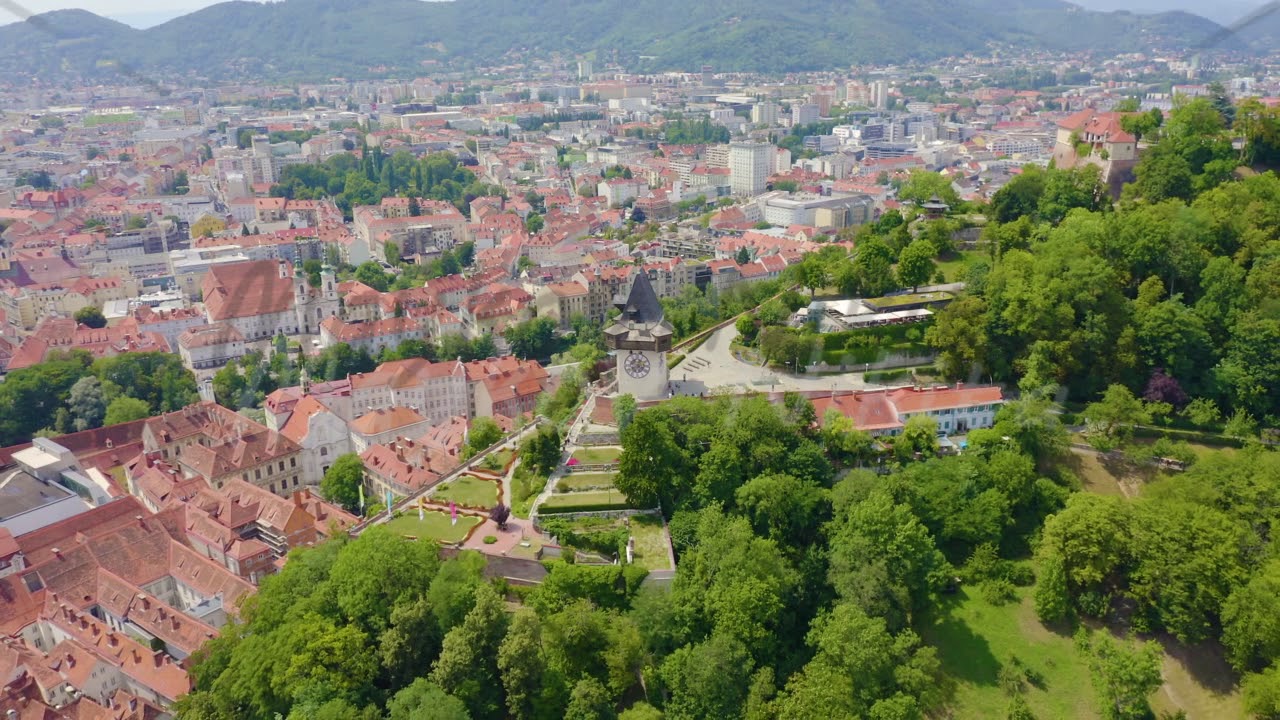Graz, Austria. Clock Tower in Graz. The historic city center aerial view. Mount Schlossberg (Castle