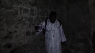 DR UMAR JOHNSON GHANA SLAVE DUNGEON POURING LIBATIONS TO ANCESTORS