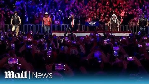 Watch Village People perform YMCA as Trump dances along