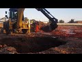 Big septic tank drop in with a backhoe