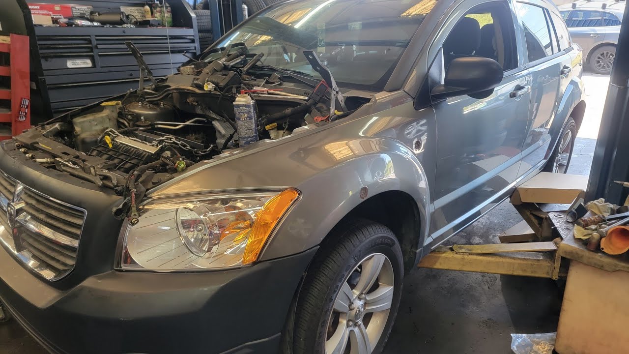 2011 Dodge Caliber Engine locked up no belt and plugs off warranty claim inspection video 