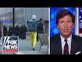 Tucker what were watching is class war disguised as race war