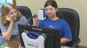 Visually-impaired child receives high-tech aids to help her see better