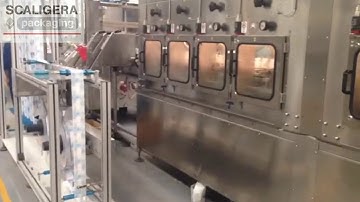 SCALIGERA PACKAGING Sleeve Applicator and Shrink Tunnel BODY PET Bottle 2 heads 50000 bph