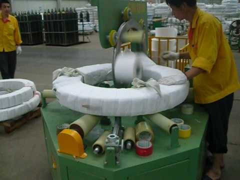 Eye vertical coil stretch wrapper and packing machine