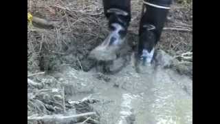 My black rubber boots in mud
