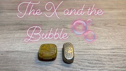 The X Fidget Slider by 42 Cosmo and the Brass Bubble by Metal Toyz