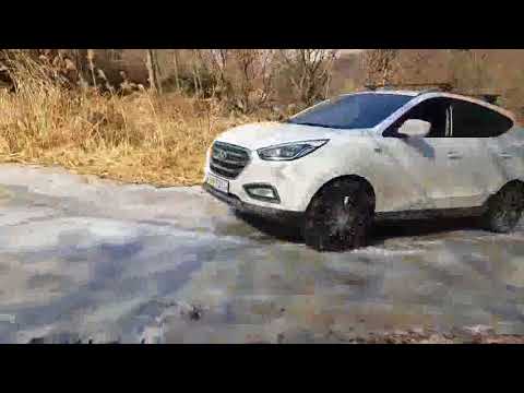 Snow chains test on the iced road and on the mud