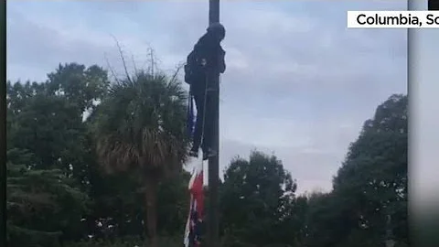 Video shows activist taking down Confederate flag in Sout...