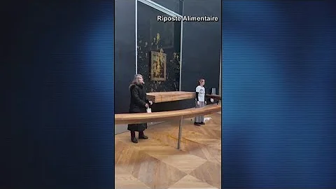 Protesters throw soup at the Mona Lisa painting