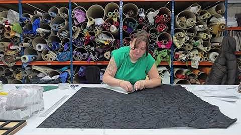Production video of a chsuble for funerals in white Duomo with a black banding, galoon and emblem.