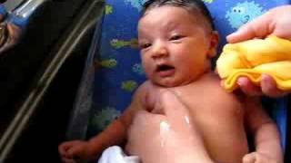 Avie getting her first bath. Part II