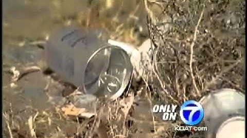 Trash piles up behind apartment complex