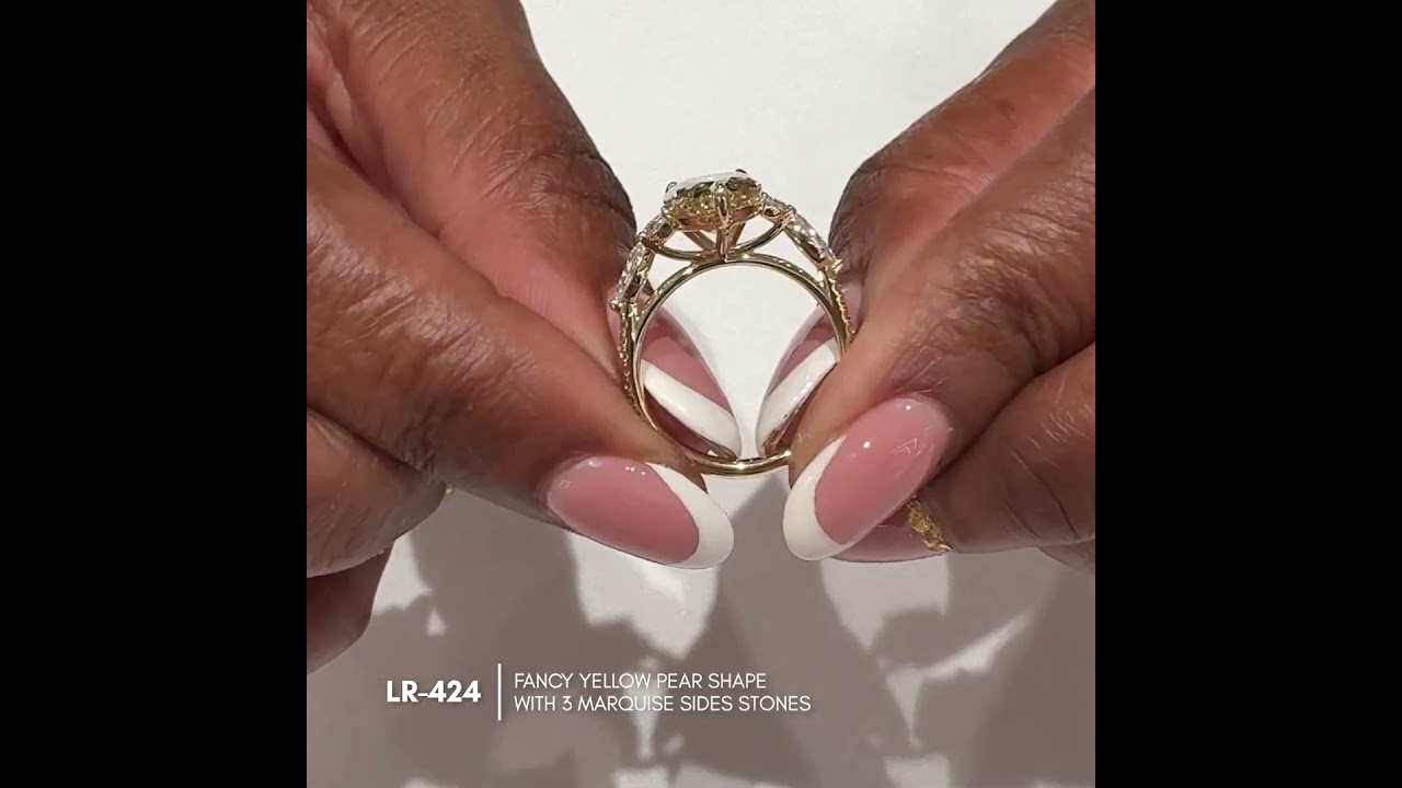 3.60 carat Fancy Yellow Pear Lab Diamond Seven-Stone Ring