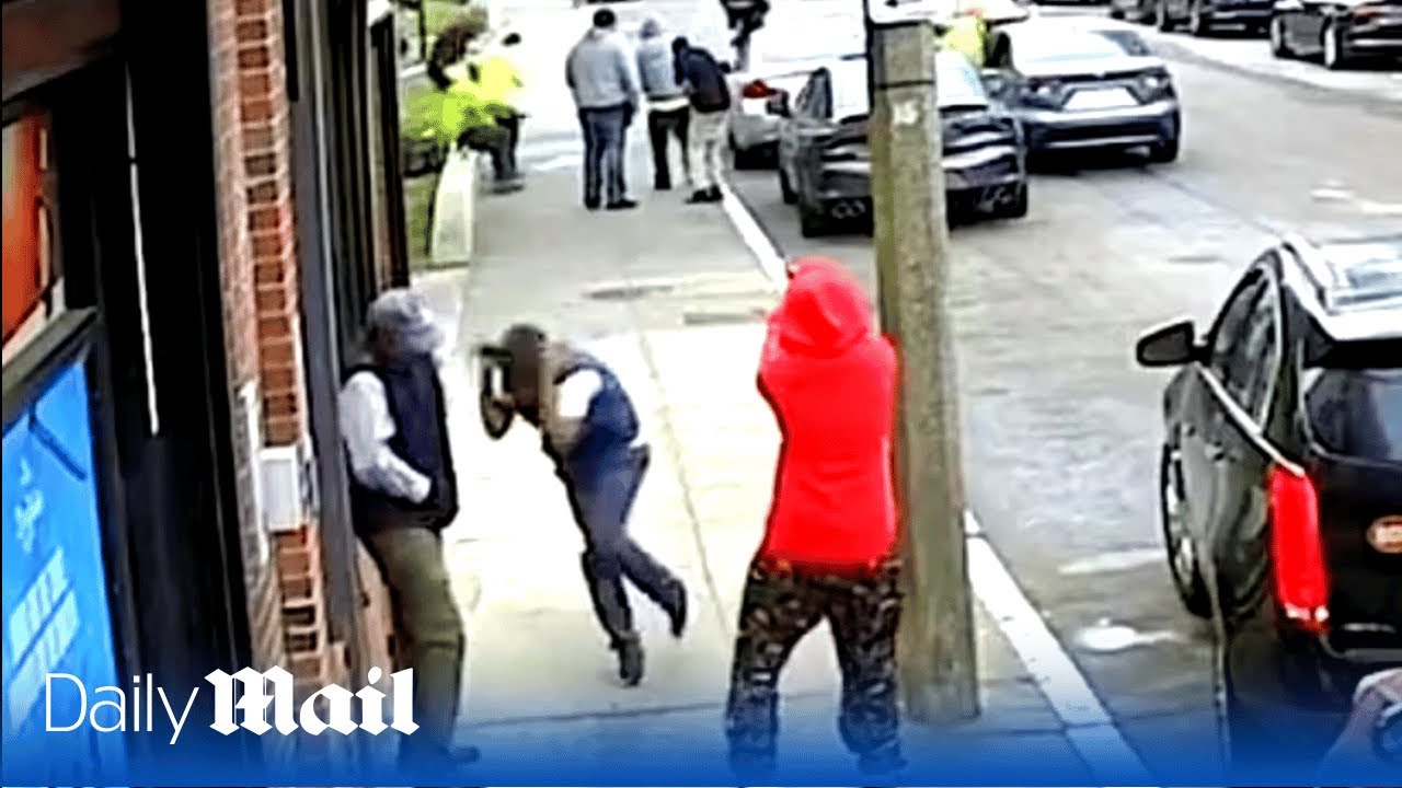 Terrifying moment two gunmen open fire in broad daylight in Boston