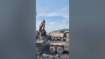 loading mini excavator in dump trailer