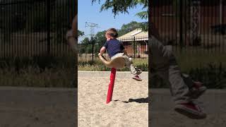 Boy spins on spinning ride at park and faceplants into sand and lands in scorpion position