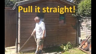 Straighten a wonky shed! Ratchet strap fix for a leaning shed. Pulling my shed straight.