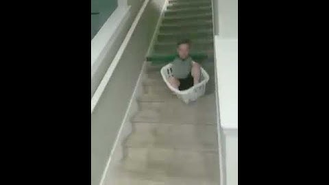 Kid Regrets Decision of Sliding Down Stairs in Laundry Basket - 1040639