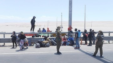 Fear of mass deportation drives dozens of undocumented migrants to leave Chile | AFP