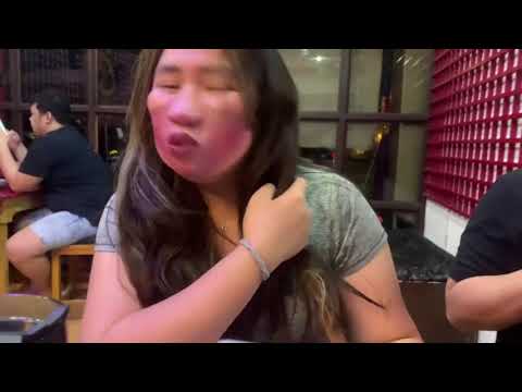Girl Wearing a Funny Facemask Ordering At a Restaurant