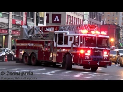The new Ferrara 100' rear-mount aerial of FDNY Ladder Company 4 is seen here responding from its quarters on 8th Avenue. 4 Truck and Battalion Chief 9 are responding to an odor of gas in a building. Engine 54 was already out. At 01:25 you'll hear the roar of a NYPD police vehicle as it speeds past me and then at 01:33 you will see it activate its emergency lights. Notice the now standard blue LED light on the rear of 4 truck and the massive air horn use to clear traffic! Manhattan, New York, New York, USA. 03.2012