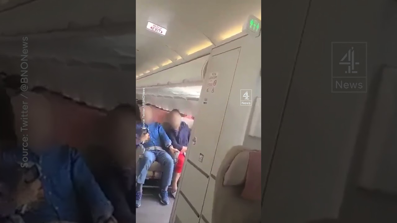 The plane door opens in mid-air