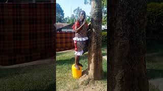 An African Hugs A Tree