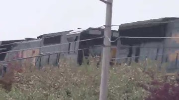 CSX Engineer Gives A Wave And The Horn On Elevated Tracks