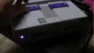 Purple LED Super Nintendo Mod
I swapped out the red power indicator with pink. When lit, it matched the SNES purple.
Level of hack: If you can get the system open, its very easy. Purple LED Super Nintendo Mod