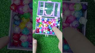 Doll In Bathtub With Falling Candy And Beads.