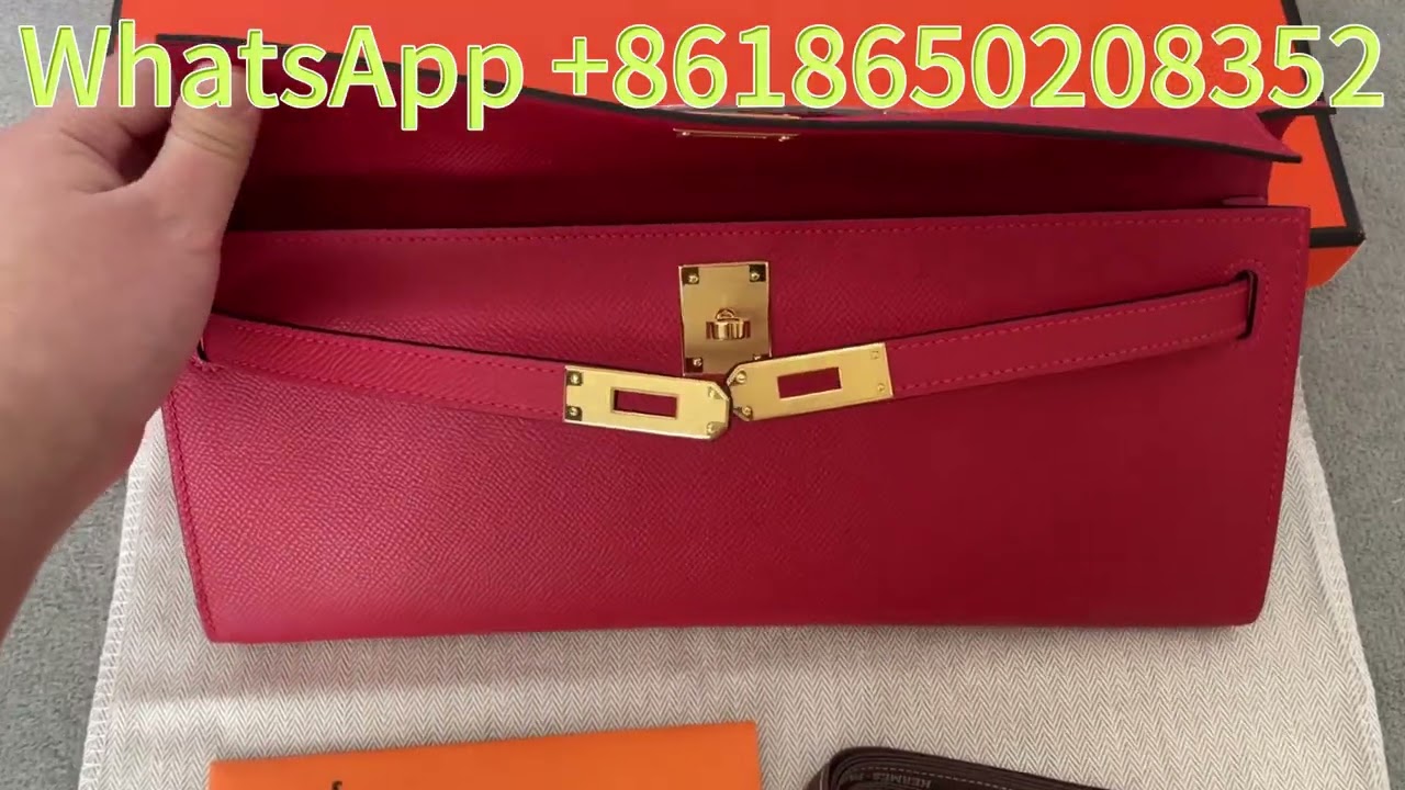H-ermès Kelly To Go wallet is made of red Epsom leather and features gold plated hardware