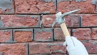 removing hard cement  from a 150 year old house with handmade bricks to reveal the lime mortar